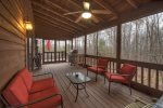 Screened in deck with patio furniture and gas grill